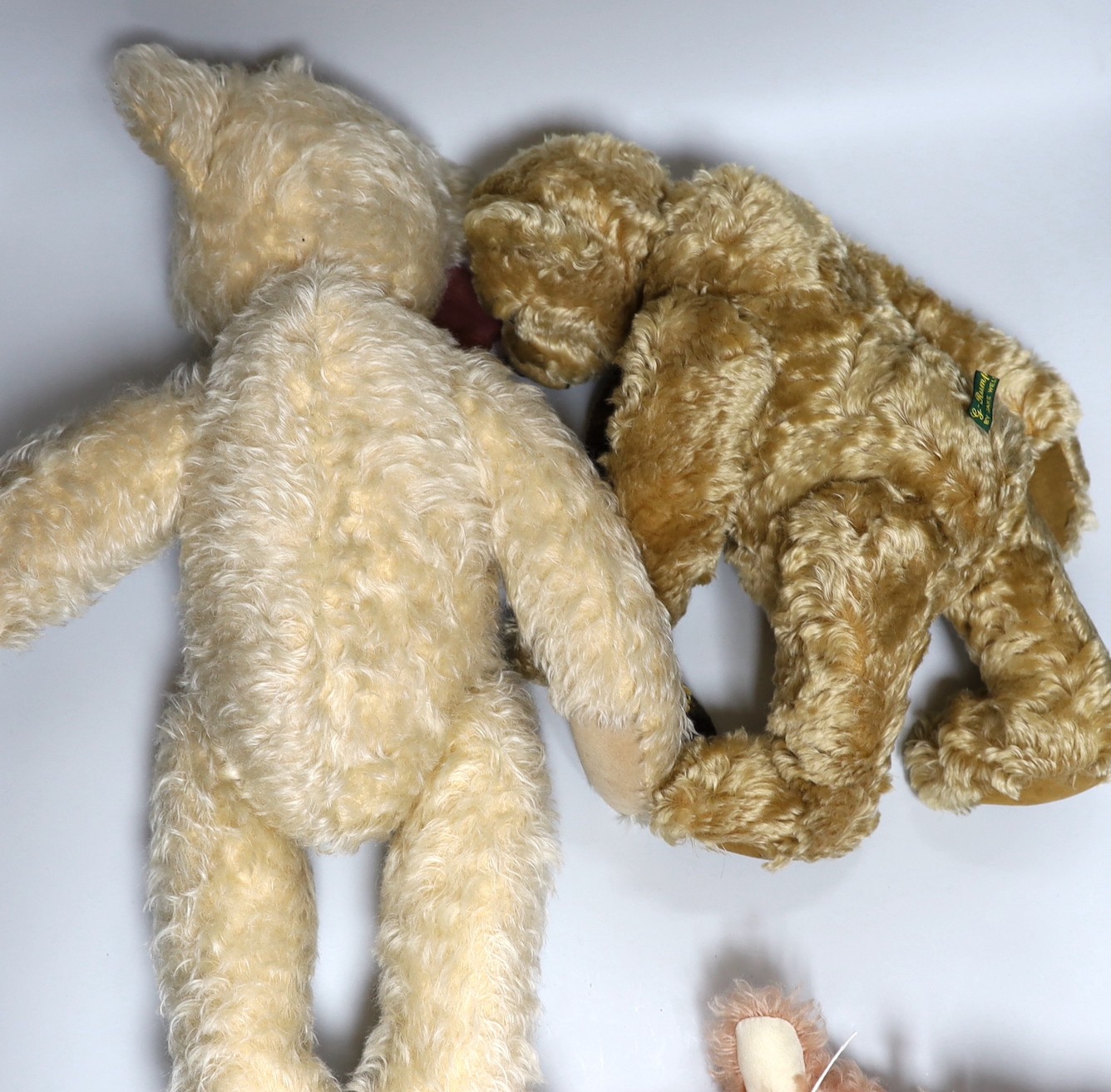 An Hermann ‘English Rose’ Teddy bear, G-Rumpy Bears ‘Emerson’, and a Deans blonde plush Teddy bear